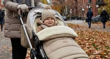 Jesienny i zimowy spacer z niemowlęciem: jak przygotować wózek na zmienną pogodę?